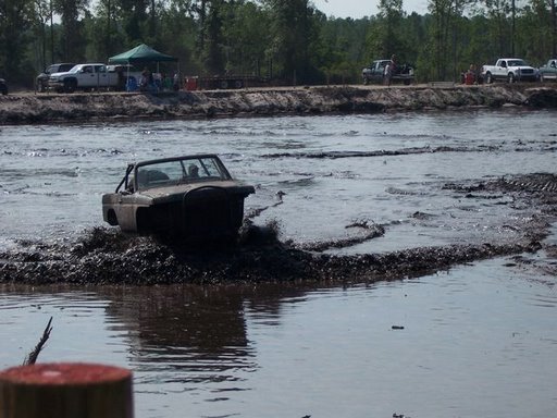 1989 Ford Bronco navigating a mud pit