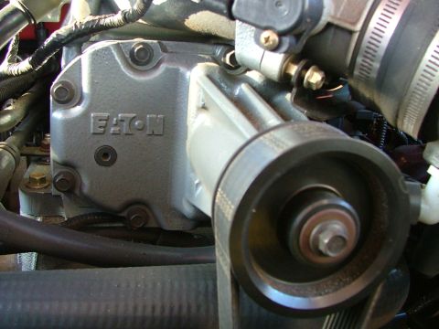 2007 Ford Mustang - Photograph of an Eaton supercharger installed in an engine bay during service.