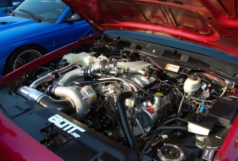 1998 Ford Crown Victoria - Photograph of a custom supercharged engine bay under an open hood, not a technical document.