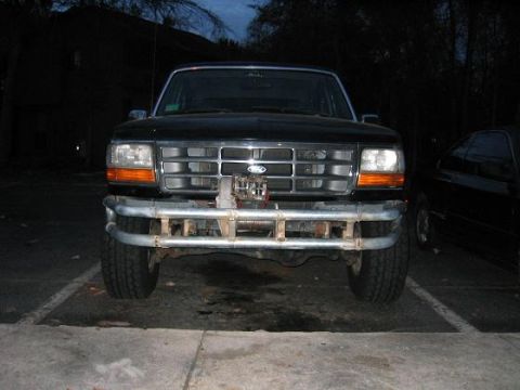1993 Ford Bronco - Front view of a 1993 Ford Bronco equipped with a winch and custom bumper.