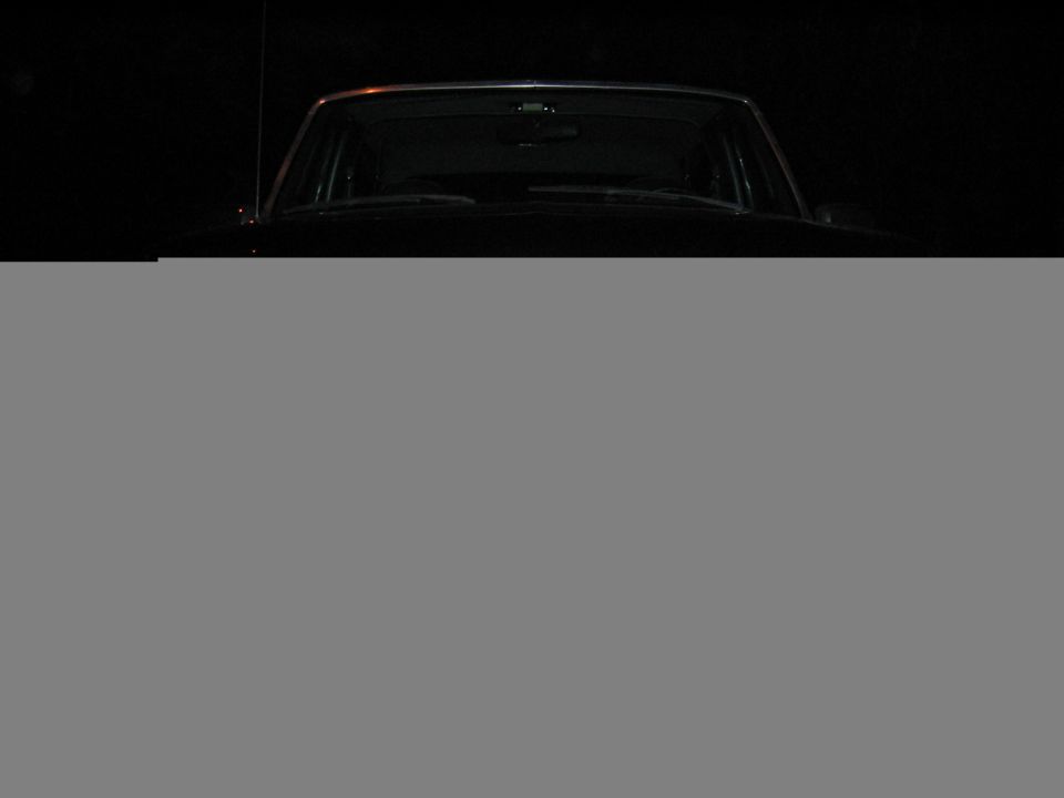 1993 Ford Bronco front view, dark exterior, visible windshield and roofline
