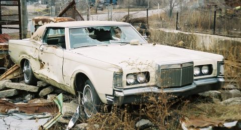 1969 Lincoln III - passenger side, glass broken door, panels bent, hubcaps great condition