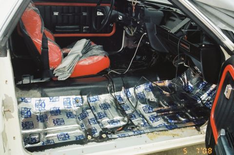 1976 Ford Ranchero - Interior view of a car's cabin, showing the seats and flooring.