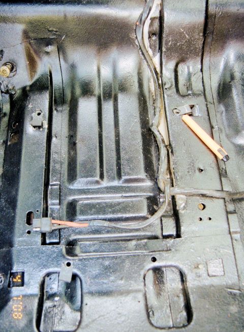 1976 Ford Ranchero - Close-up view of the interior floor pan, showing wiring and a tool. The time '1:08' is visible on a small display.
