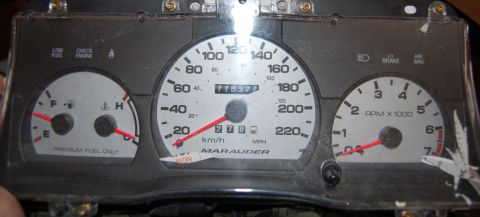 1985 Mercury Grand Marquis - Instrument cluster from a car, showing gauges for speed, RPM, fuel, and temperature. The 'Marauder' label is visible.