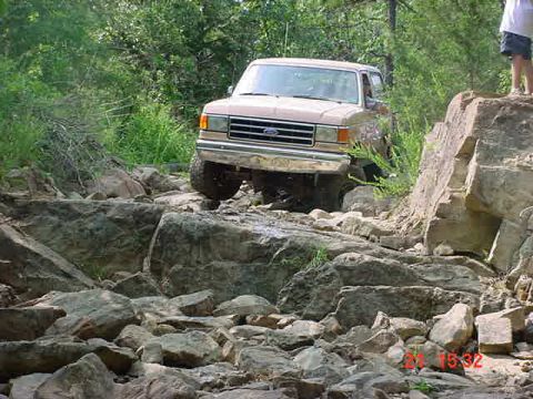 1989 Ford Bronco - This 1989 Ford Bronco tackles a challenging rocky trail, demonstrating its off-road capabilities.