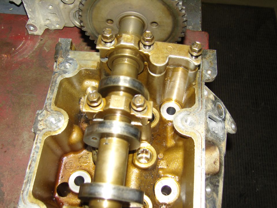 Cylinder head close-up with camshaft, cam gear and bearing caps