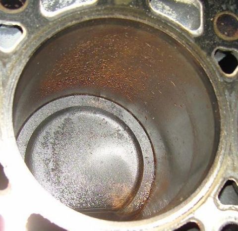 2007 Ford Mustang - Photograph looking down an engine cylinder bore showing the piston crown and cylinder wall, not a technical document.