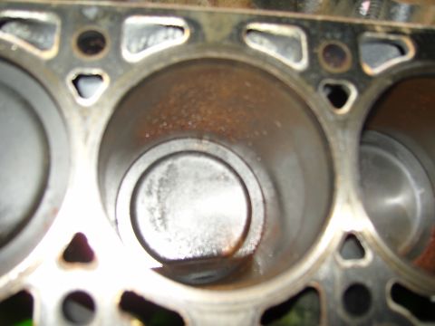 2007 Ford Mustang - Photograph close-up of an engine cylinder bore and piston in the block deck, not a technical document.