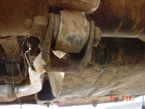 1989 Ford Bronco - The photo shows the underside of a vehicle, focusing on suspension parts and the exhaust system.