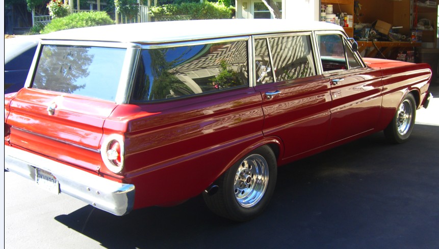 Red and white Ford Falcon two-door wagon rear three-quarter view with polished wheels