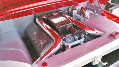 2007 Ford Mustang - Custom engine bay features a prominent supercharger and polished chrome intake pipes, with "5000" visible on a component.