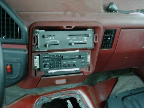 1987 Ford F-150 - Close-up of a car's dashboard showing the radio and air conditioning vents.