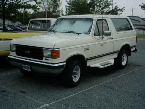 1988 Ford Bronco - This 1988 Ford Bronco is shown in a 3/4 front view, parked in a lot.