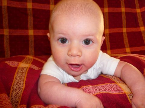 1996 Ford Probe - Baby looking at the camera while lying on a blanket.