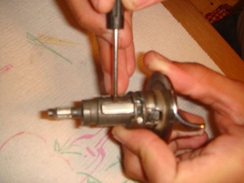 1992 Ford Bronco - A close-up view of an ignition lock cylinder being serviced.