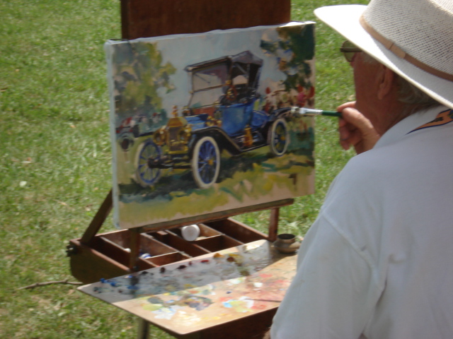 Artist painting a 1911 torpedo roadster