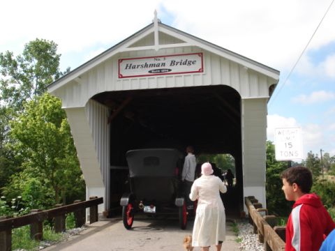 1909 Ford Model T - A vintage touring car enters the Harshman Bridge, built in 1894.