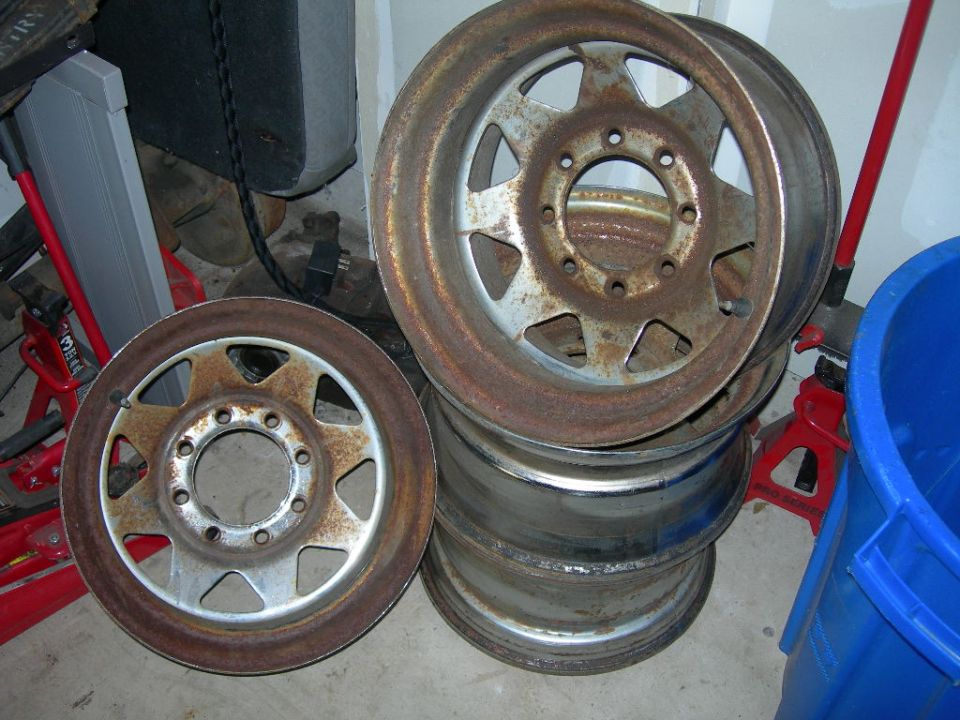 stack of rusty wheels, one in front