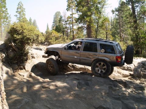 1999 Jeep Grand Cherokee - This 1999 Jeep Grand Cherokee is shown tackling a challenging rocky off-road course.