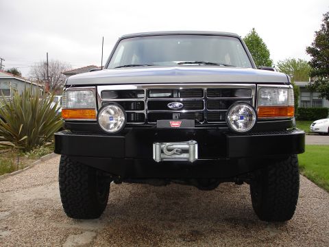 1994 Ford Bronco - Frontal view of a 1994 Ford Bronco, equipped with a winch and additional lighting on the bumper.