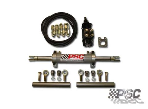 1992 Ford Mustang - A collection of power steering components, including a cylinder, hoses, and various fittings, are laid out against a white background.