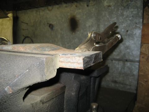 1995 Ford Bronco - Metal bar secured in a vise with locking pliers attached to the end.