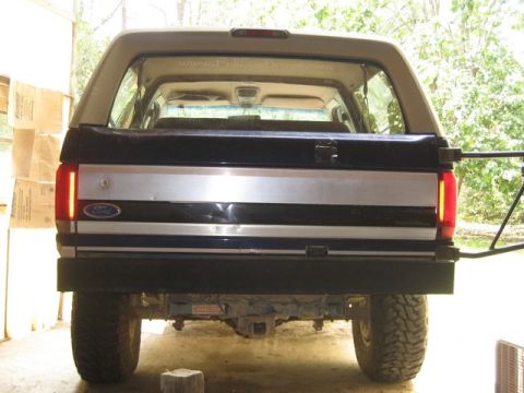 1995 Ford Bronco - Rear view of a 1995 Ford Bronco showing its tailgate, bumper, and tires.