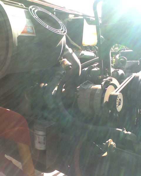 1989 International School Bus - Close-up view of the engine compartment, showing the air filter and other engine components.