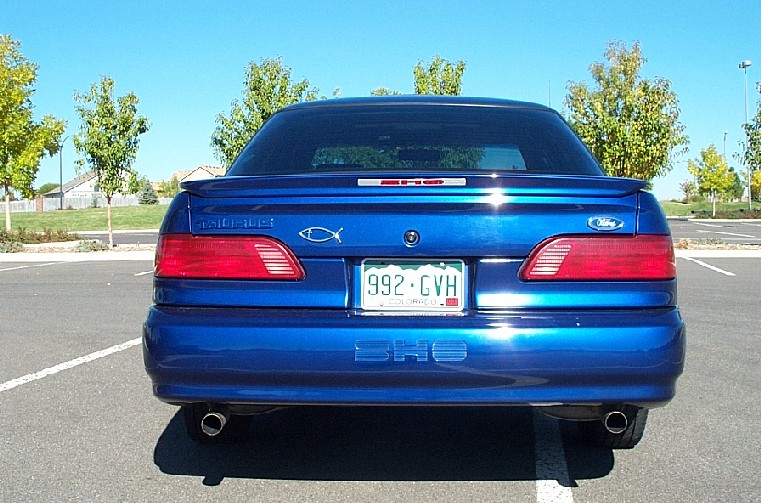 Rear of blue Ford Taurus SHO sedan with SHO trunk badge and Colorado plate