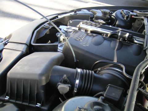 2002 BMW M3 - Close-up of the engine bay in a 2002 BMW M3, focusing on the air intake system.