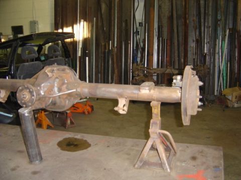 1996 Ford Bronco - Rear axle assembly with disc brake, likely from a truck or SUV, is shown on jack stands.