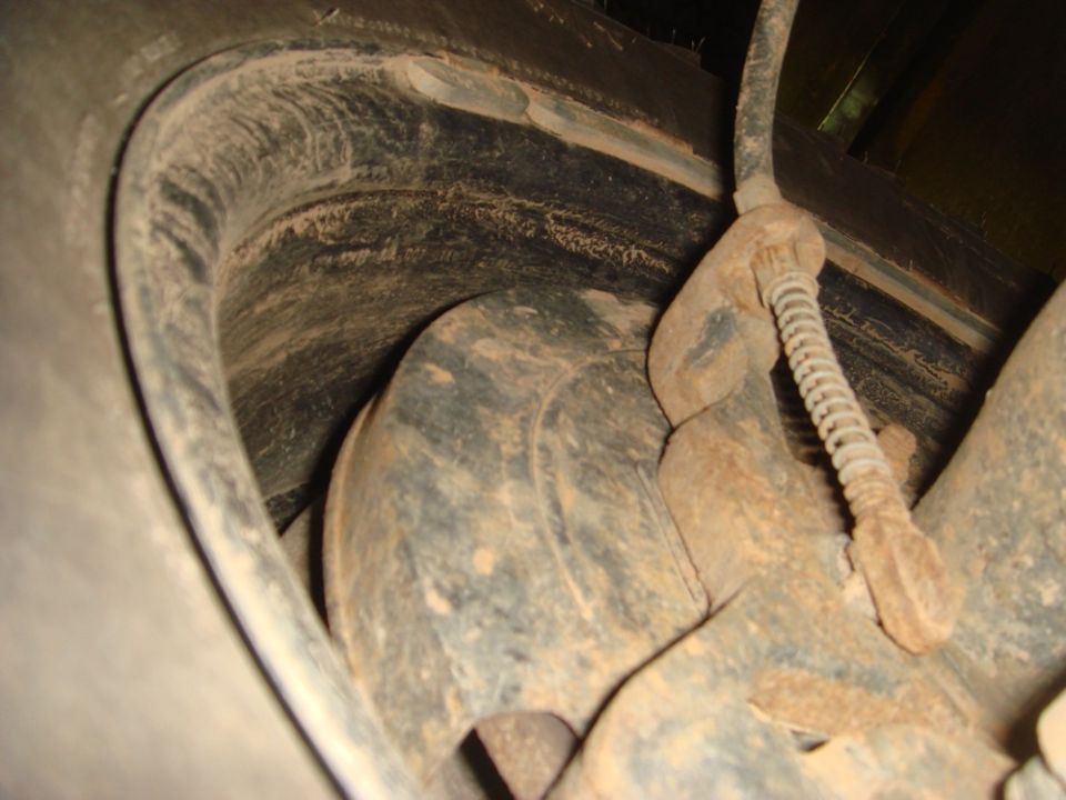 Rear brake rotor and caliper assembly with suspension components and brake line