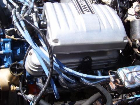 1973 Ford Ranchero - Close-up view of a Ford V8 engine, likely from a 1973 Ford Ranchero, showing the intake manifold, spark plug wires, and exhaust headers.