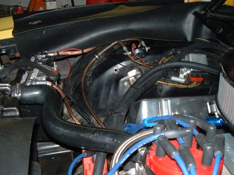 1978 Ford Ranchero - Close-up view of the engine bay, focusing on the battery, starter solenoid, and various electrical connections.