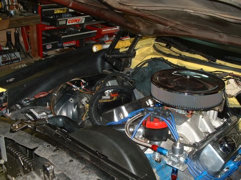 1978 Ford Ranchero - Close-up view of a modified V8 engine in a vehicle's engine bay.