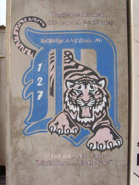 1978 Ford Bronco - Mural on a wall depicts a tiger and text related to the Tuskegee Airmen and Selfridge ANG Base.
