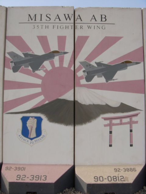 1978 Ford Bronco - Military artwork on concrete barriers depicts fighter jets and Mount Fuji.