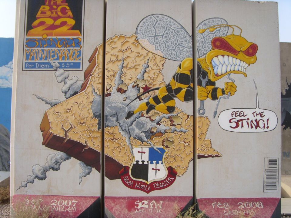 Hornet 'Feel the Sting' unit mural painted on concrete blast barriers