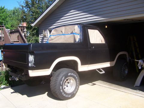1986 Ford Bronco - This Ford Bronco is undergoing a paint job, with its windows covered in masking paper.
