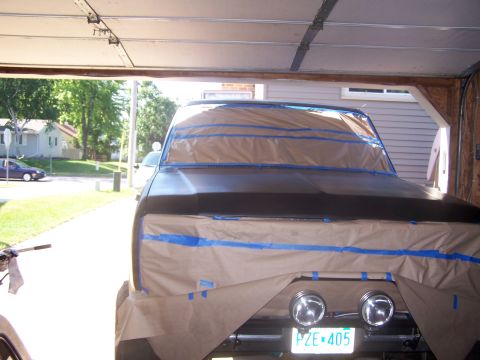 1986 Ford Bronco - The front of a 1986 Ford Bronco is covered in masking paper and tape, ready for a new paint job.