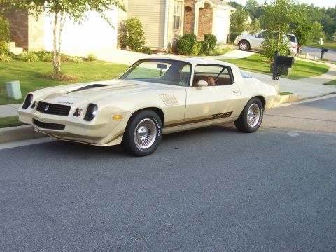 1979 Chevrolet Camaro - A beige 1978 Chevrolet Camaro Z28 is parked curbside in a suburban neighborhood.