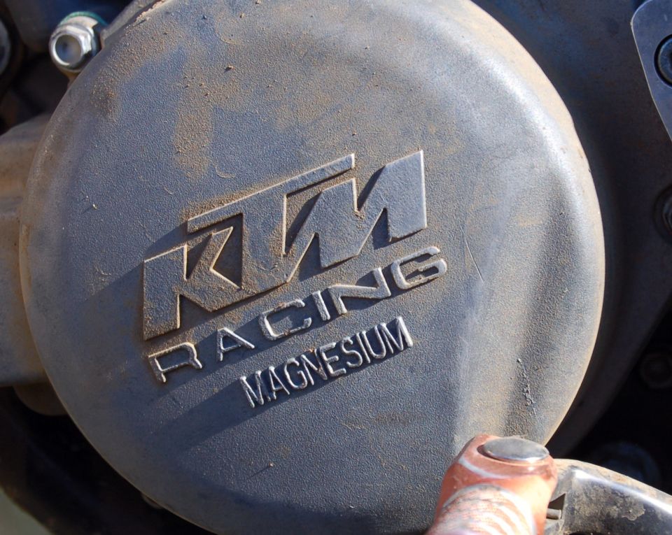 KTM Racing magnesium engine case cover with embossed logo, dusty gray finish