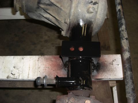 1987 Suzuki Samurai - Differential housing with a newly installed black metal bracket for suspension modification.