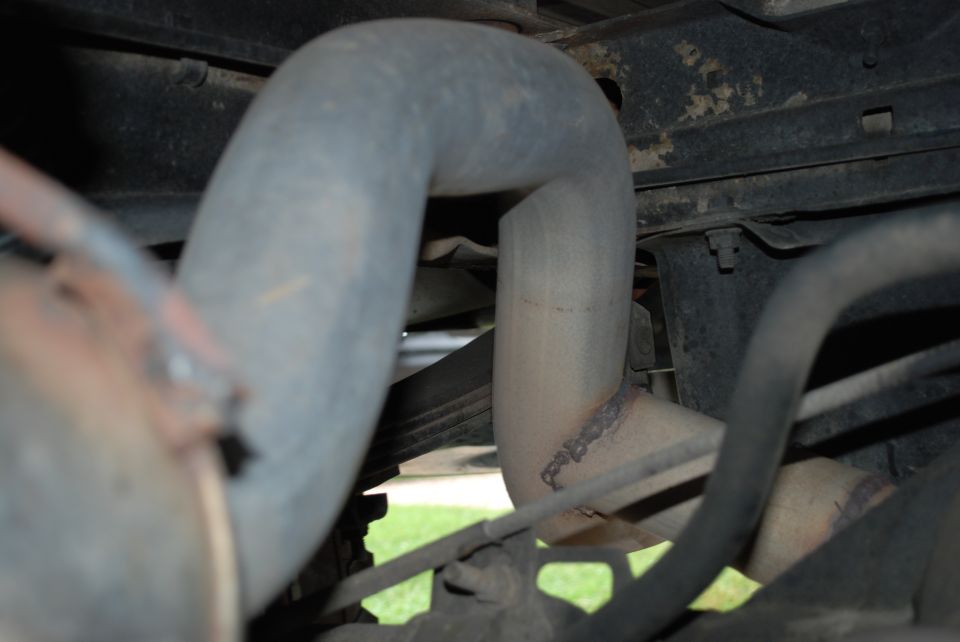 Exhaust pipe and undercarriage components