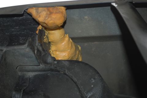 1994 Ford Bronco - Expanding foam insulation has been applied to a section of the vehicle's frame.
