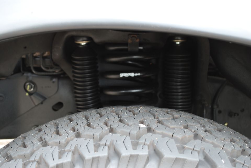 close-up of front tire and suspension components