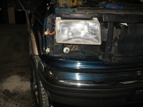 1995 Ford C-350 (Centurion Conversions) - The front end of a Ford F-Series truck is shown with the headlight assembly removed for access to the intercooler.