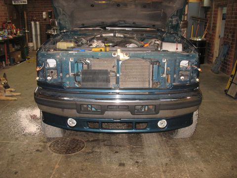 1995 Ford C-350 (Centurion Conversions) - Front view of a 1995 Ford C-350 (Centurion Conversions) with the hood open, revealing the engine and radiator assembly.