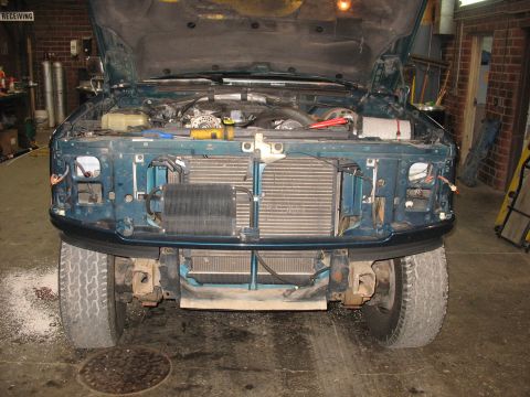 1995 Ford C-350 (Centurion Conversions) - Front view of a 1995 Ford C-350 (Centurion Conversions) with the hood open, revealing the engine and cooling system.